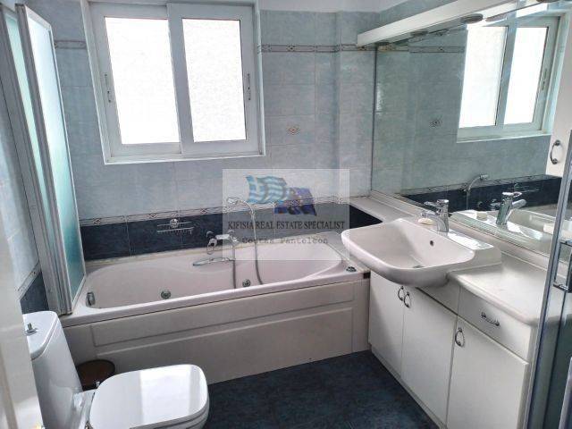 BATHROOM WITH BATHTUB AND SHOWER