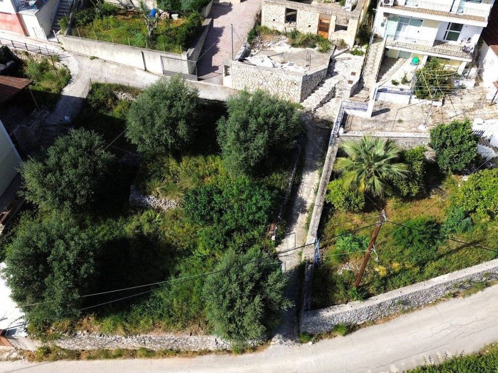 Aerial views of the land with building plot