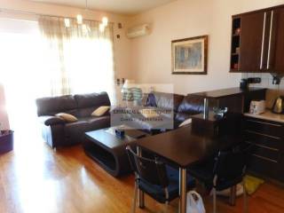 VIEW OF THE LIVING ROOM - OPEN PLAN KITCHEN