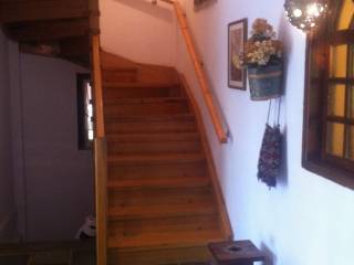 INNER WOODEN STAIRCASE TO GROUND FLOOR APARTMENT/PLAYROOMS