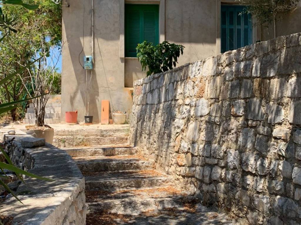 Staircase leading to terrace and house