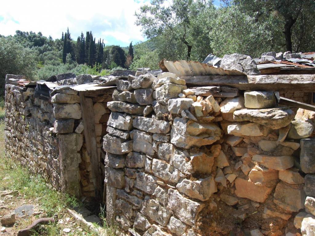 Stone water tank on land for sale