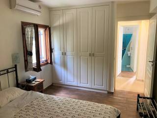 Spacious bedroom with built in cupboards