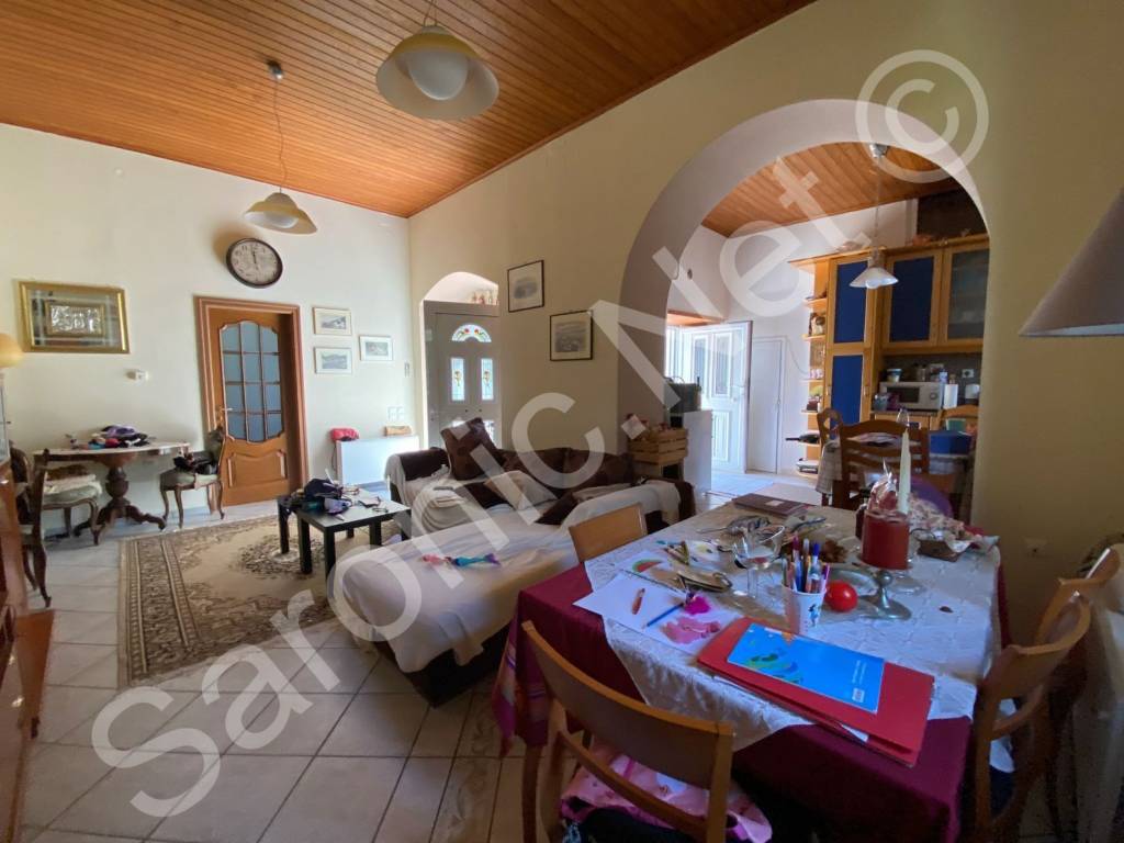 Living room, kitchen thru arch, 2 front doors from courtyard