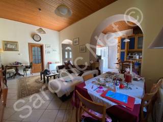 Living room, kitchen thru arch, 2 front doors from courtyard