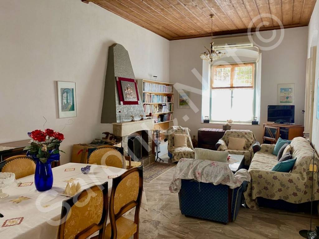 Living room window overlooks approach street