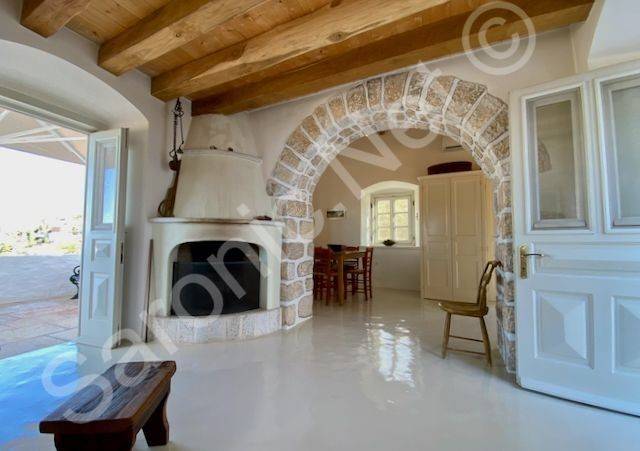 Top floor living space with fireplace and large balcony