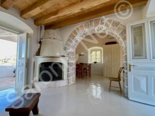 Top floor living space with fireplace and large balcony