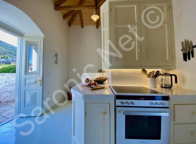 Kitchen, open door to east side terrace with inland views