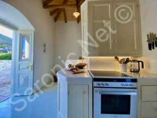 Kitchen, open door to east side terrace with inland views