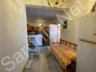 Inner sitting room to kitchen, right to entrance hall