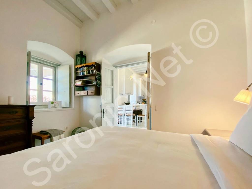 Ground floor bedroom with shuttered window.