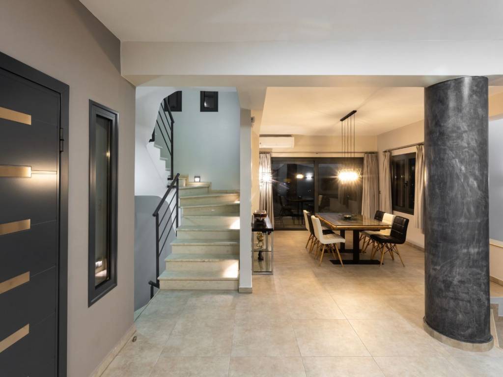 Staircase to 1st floor from dining room. Double patio doors.