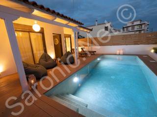 Fenced mineral pool and terrace, doors from property.