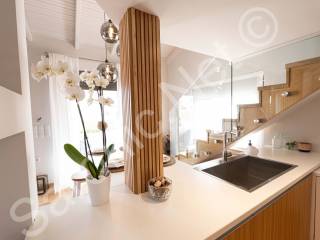 Modern kitchen, halogen hob and stairs to mezzanine floor.