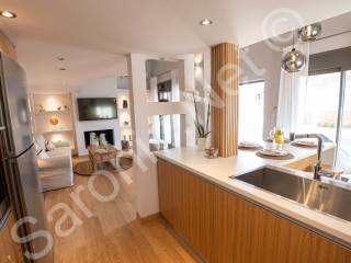 Kitchen, large sink, american fridge thru to living space.