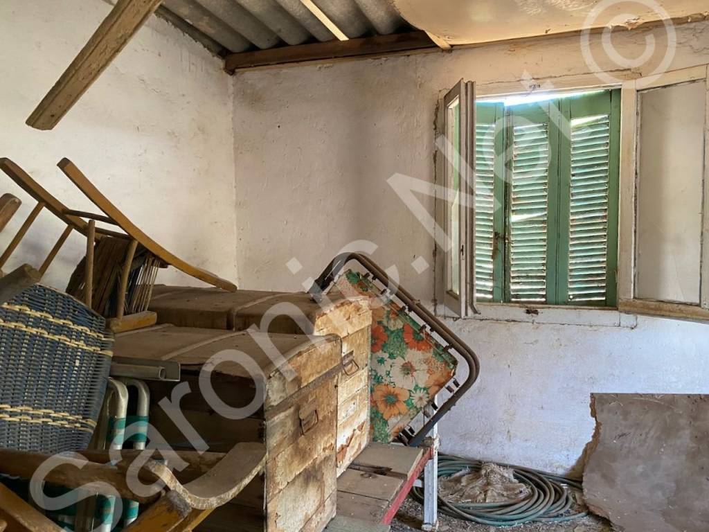 2nd room of building with window and countryside views.