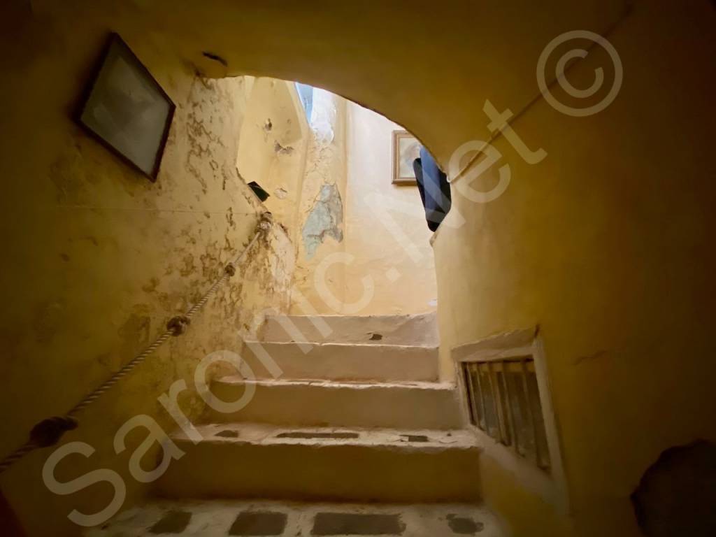 Covered stone steps to 1st floor