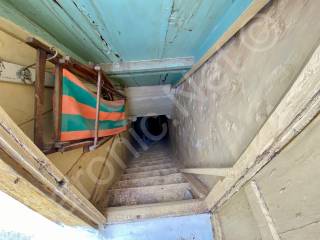 Staircase down from roof terrace to the apartment.