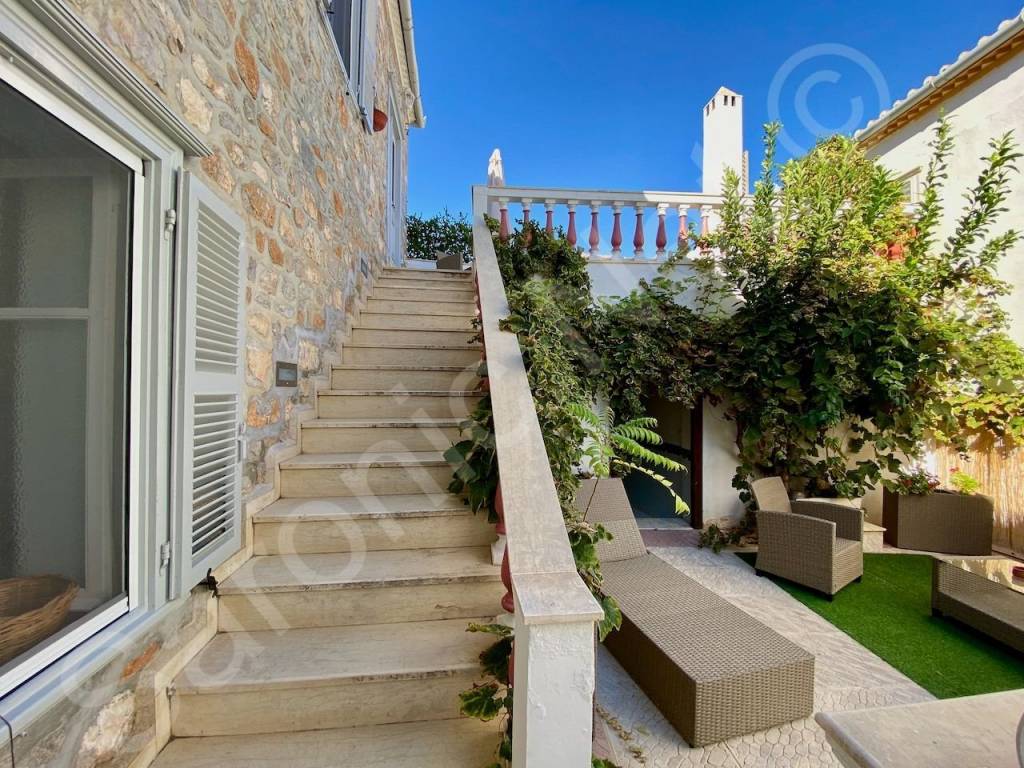 Stairs to top floor of main house terrace from courtyard