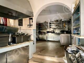 Left from courtyard to existing taverna kitchen