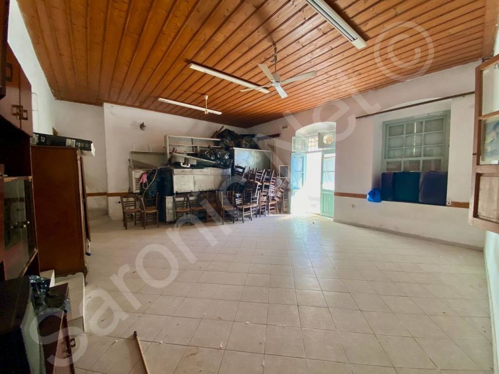 Main room, ceramic tile flooring and wooden ceiling