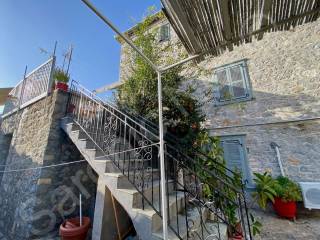 External stairs from courtyard to mid level kitchen terrace