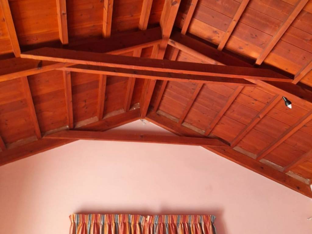 A high wooden celling in Master bed room