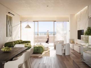 Living room with view of the swimming pool and the sea.