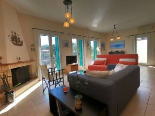 Living room with fireplace and balcony doors