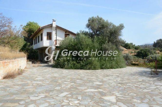 Παραθαλάσσιο Οικόπεδο με Κατοικία προς πώληση στα Στύρα