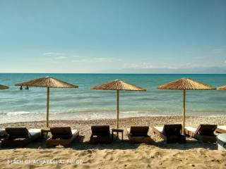 Beach bar with sunbeds closeby