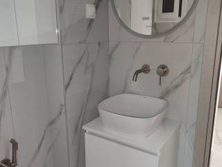 Forumland Real Estate, Μπάνιο