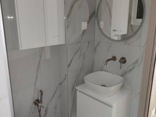 Forumland Real Estate, Μπάνιο