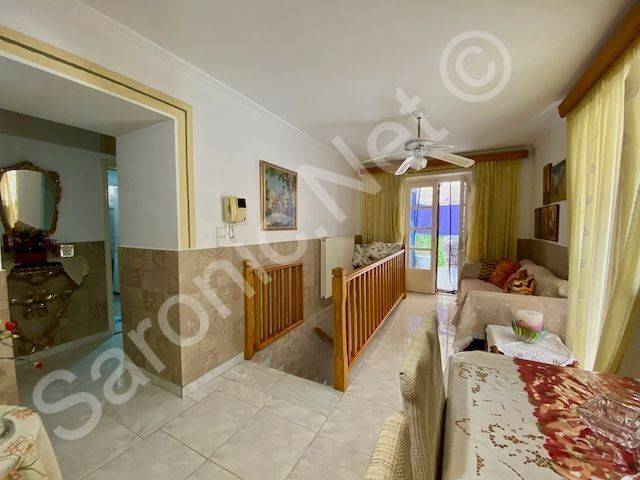 Stairs up living dining room. Arch to bedroom and bathroom.