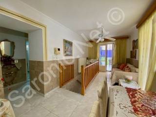 Stairs up living dining room. Arch to bedroom and bathroom.