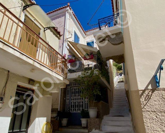 Steps from street up to apartment and studio with terrace.