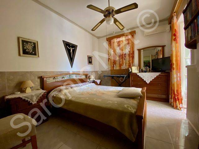 Master double bedroom with patio doors to terrace.