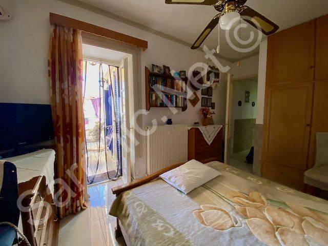 Bedroom 1, door to balcony terrace and oil fired radiator.