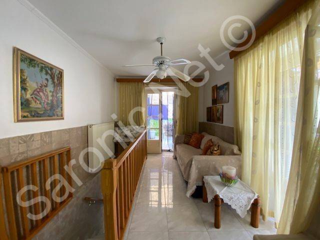 Stairs up to living area and doors to both balcony terraces