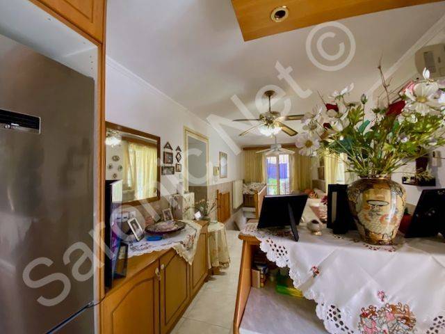 Living room storage sideboard from kitchen. American fridge.