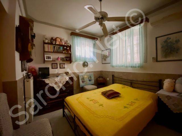 Bedroom 2 with 2 windows and ceiling fan.