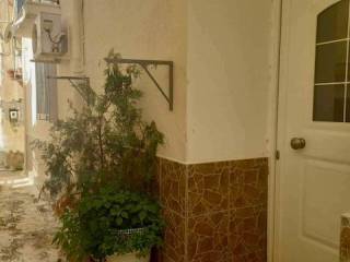 Side street of Poros with main front entrance to apartment.