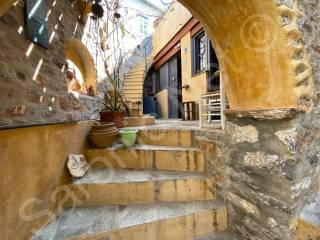 External stairs down from mid-level terrace to ground floor