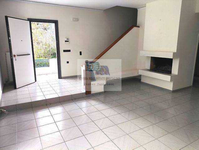 LIVING ROOM WITH FIREPLACE - ENTRANCE