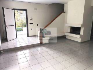 LIVING ROOM WITH FIREPLACE - ENTRANCE