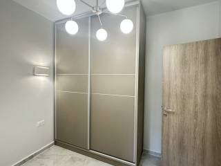 Forumland Real Estate, υπνοδωμάτιο με ντουλάπα