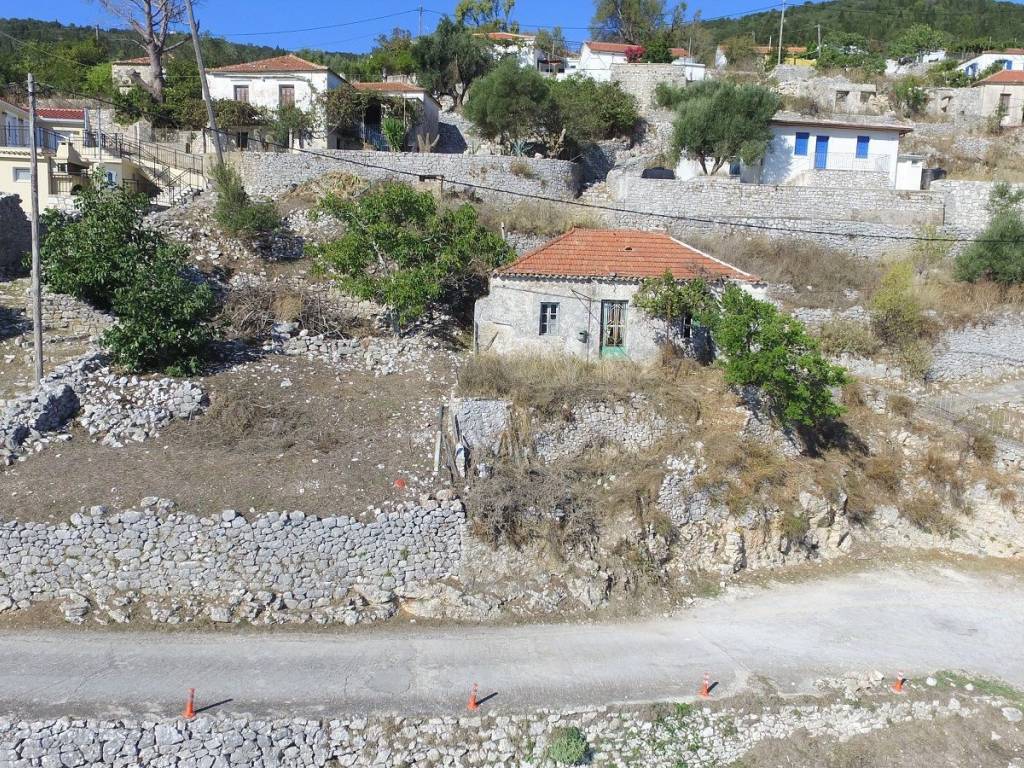 Aerial view of land with house