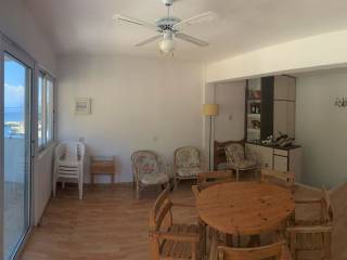 Apartment open plan kitchen and living area with sea view