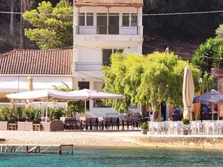 Apartment complex for sale seen from the sea